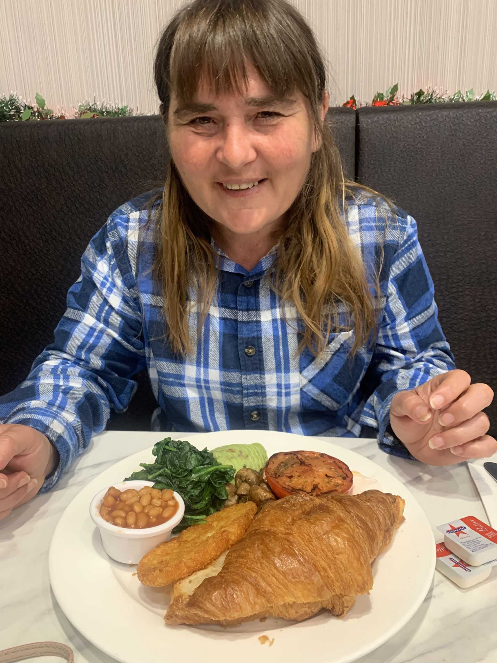 A Woman with a Plate of Food on the Table — Keilor East, VIC — North West Melbourne Family Respite
