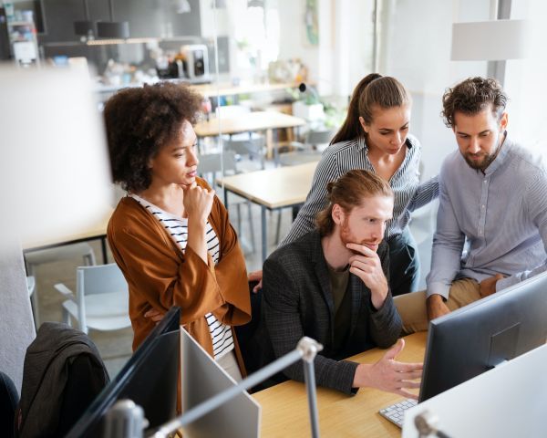 Group of People Looking at a Computer Screen — Keilor East, VIC — North West Melbourne Family Respite