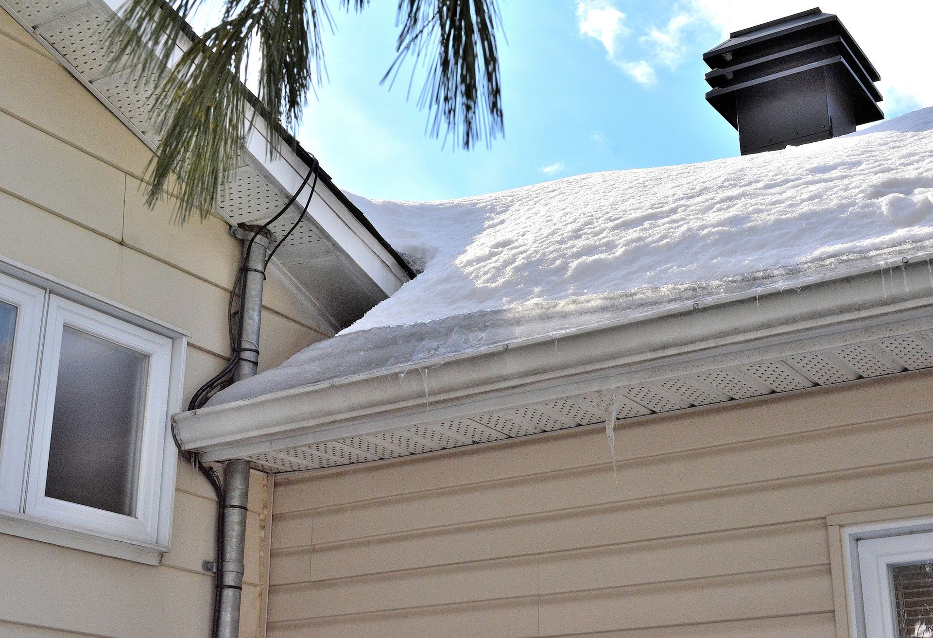 Icy Roof with Close Eaves - Calgary, AB - KRAFT Exteriors & Developments Ltd.