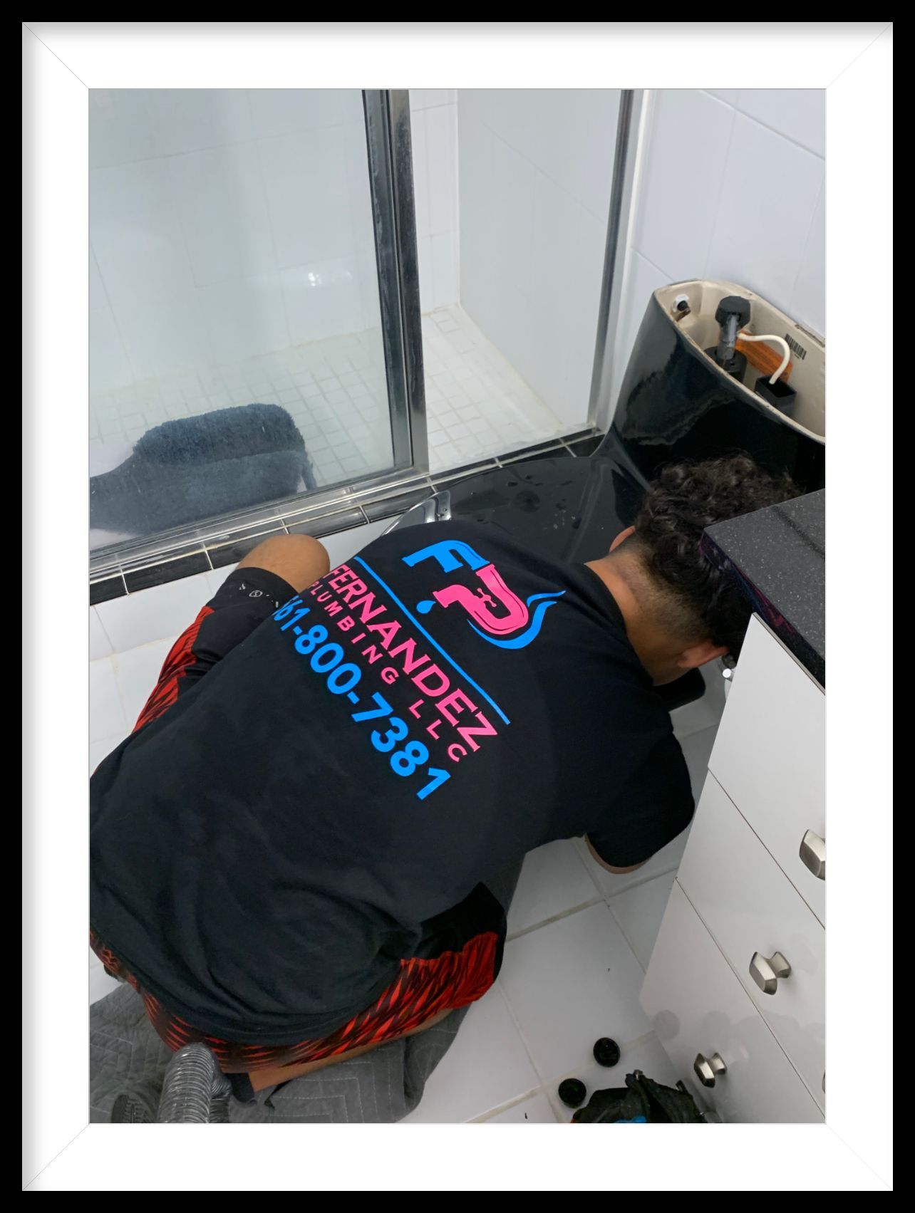Man Fixing A Sink — Palm Beach, FL — Fernandez Plumbing