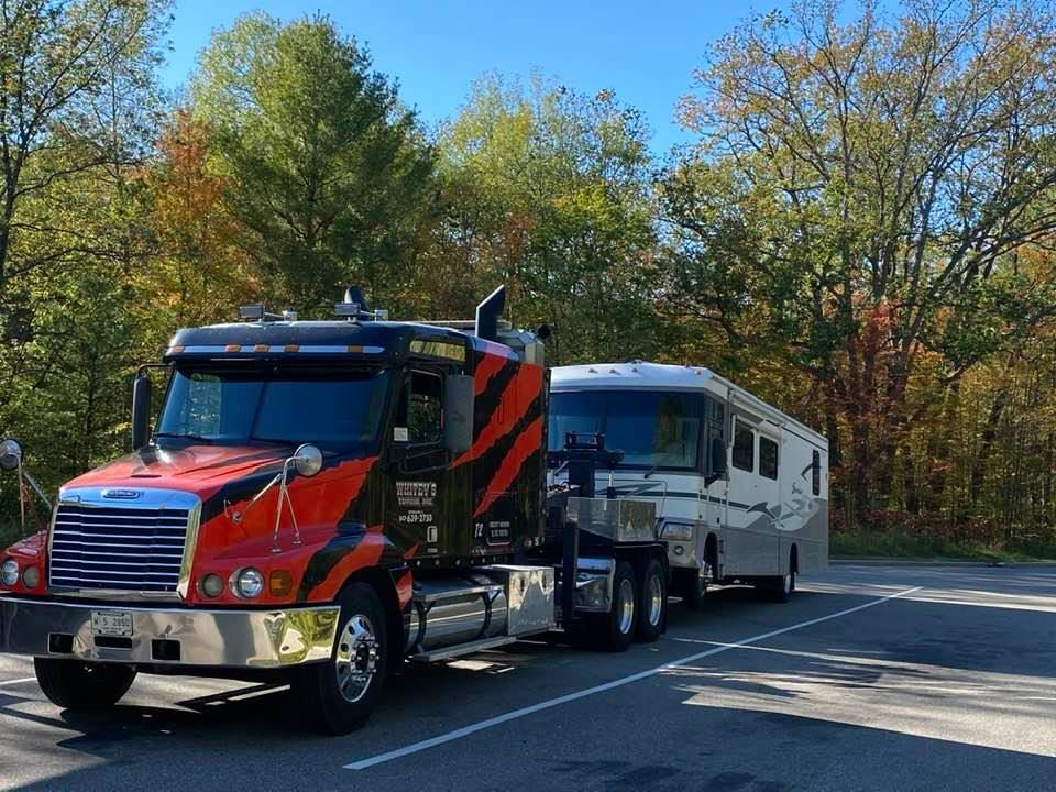 Black Car Towing — Crystal Lake, IL — Whitey's Towing Black Car Towing — Crystal Lake, IL — Whitey's Towing