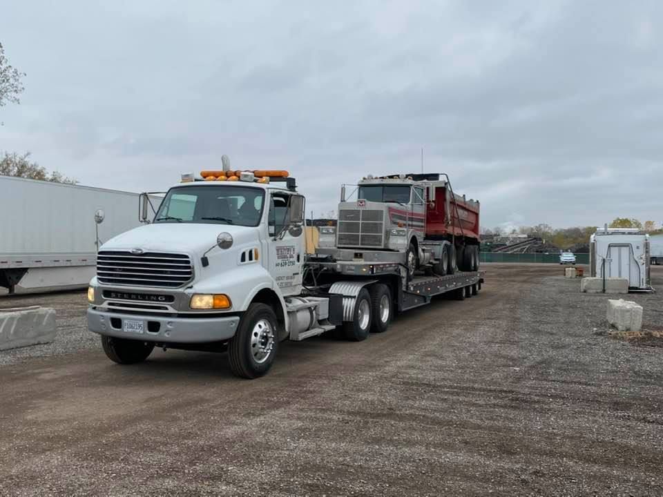 Black Car Towing — Crystal Lake, IL — Whitey's Towing Black Car Towing — Crystal Lake, IL — Whitey's Towing