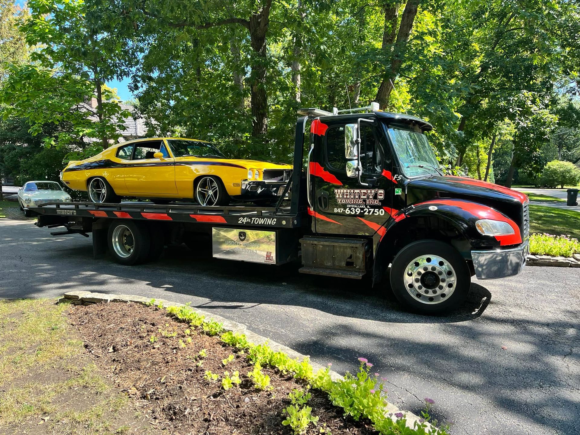Black Car Towing — Crystal Lake, IL — Whitey's Towing Black Car Towing — Crystal Lake, IL — Whitey's Towing