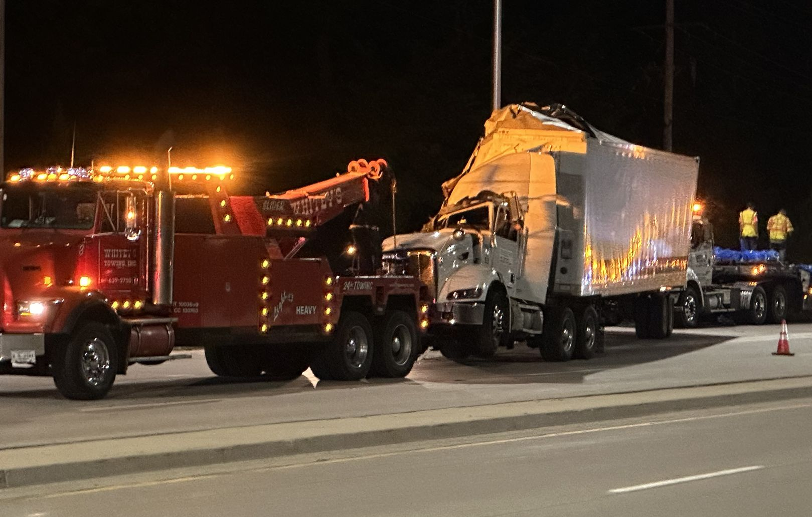 Black Car Towing — Crystal Lake, IL — Whitey's Towing Black Car Towing — Crystal Lake, IL — Whitey's Towing