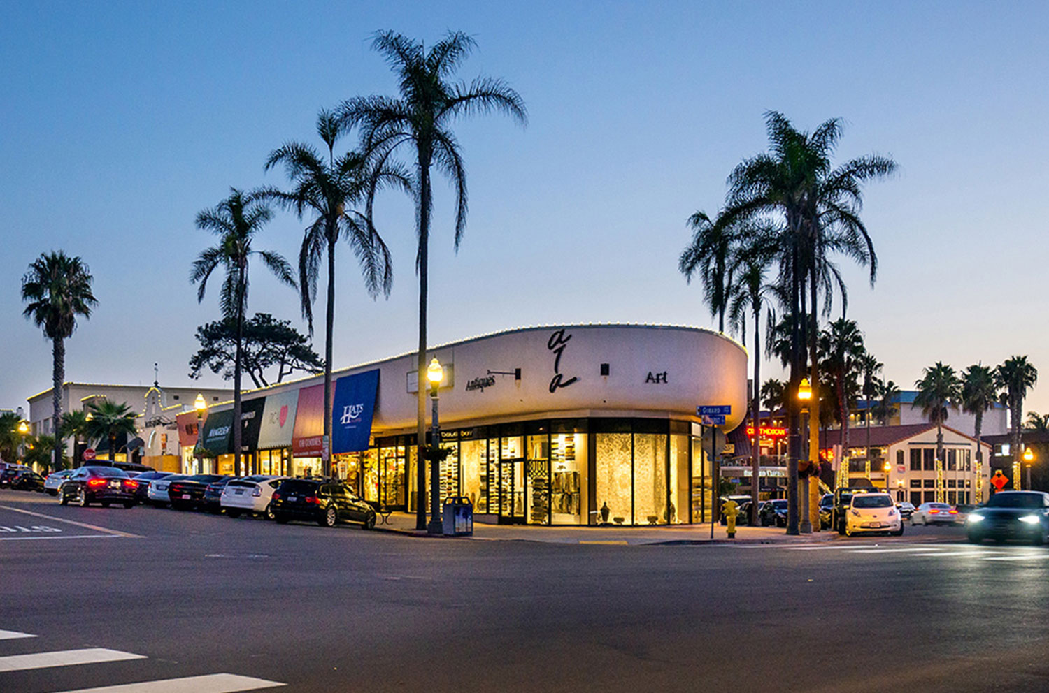 A building with a lot of cars parked in front of it
