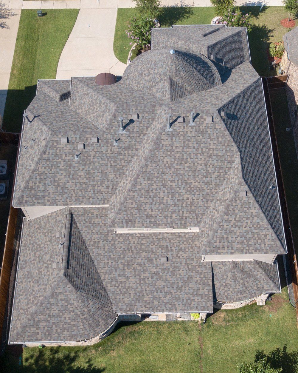 an aerial view of a large house with a dome shaped roof