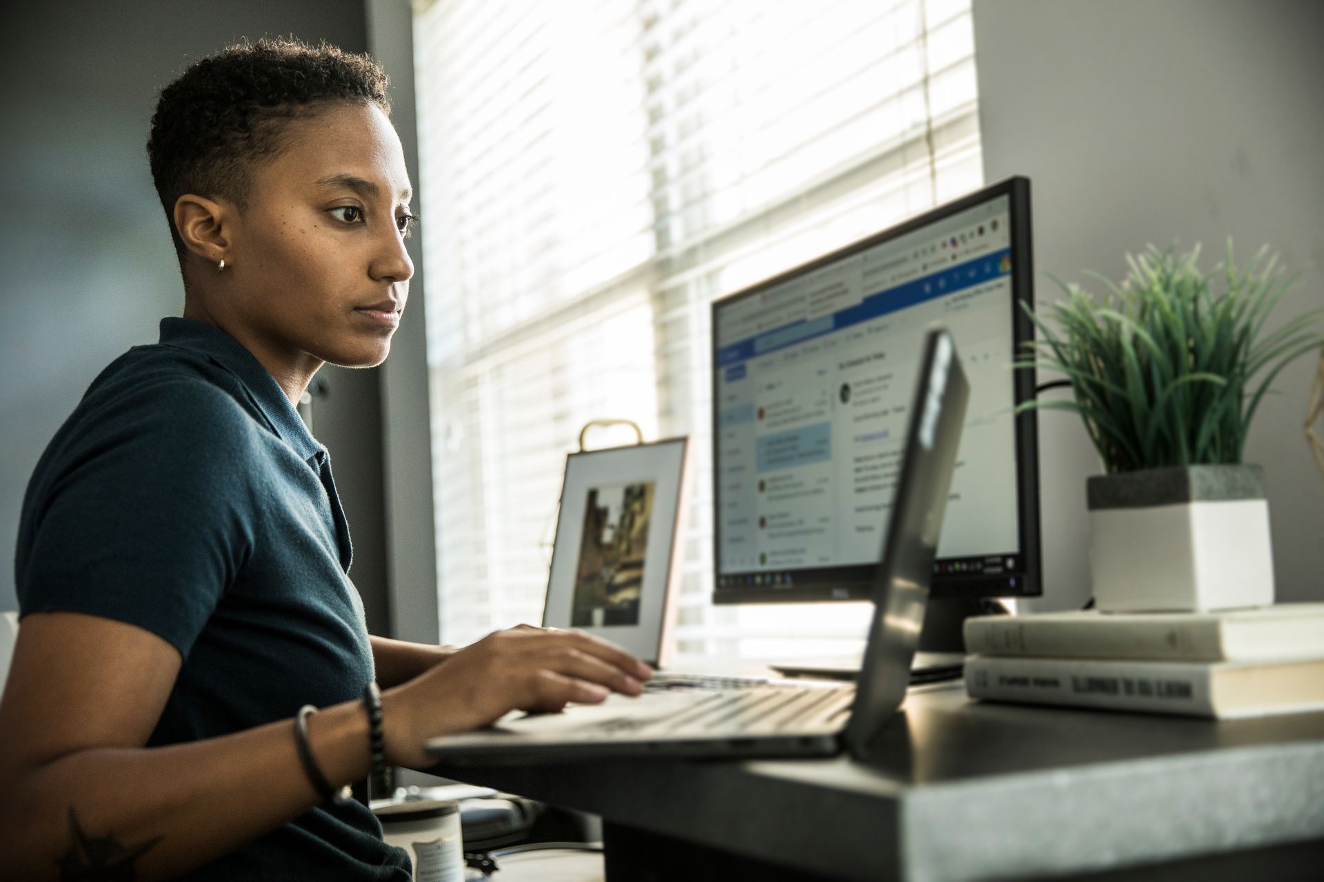 Woman studying on laptop at home