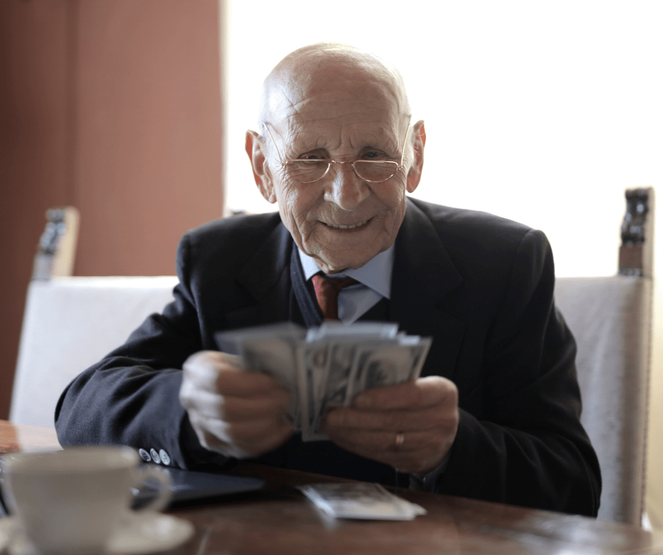 Senior man in suit, counting US dollar bills. Senior man in suit, counting US dollar bills.