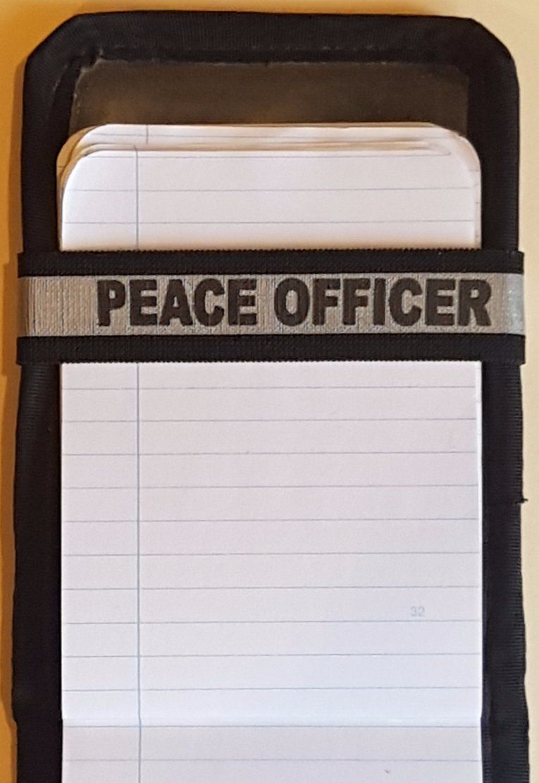 A Notebands™ for your Duty Notebook that says peace officer on it
