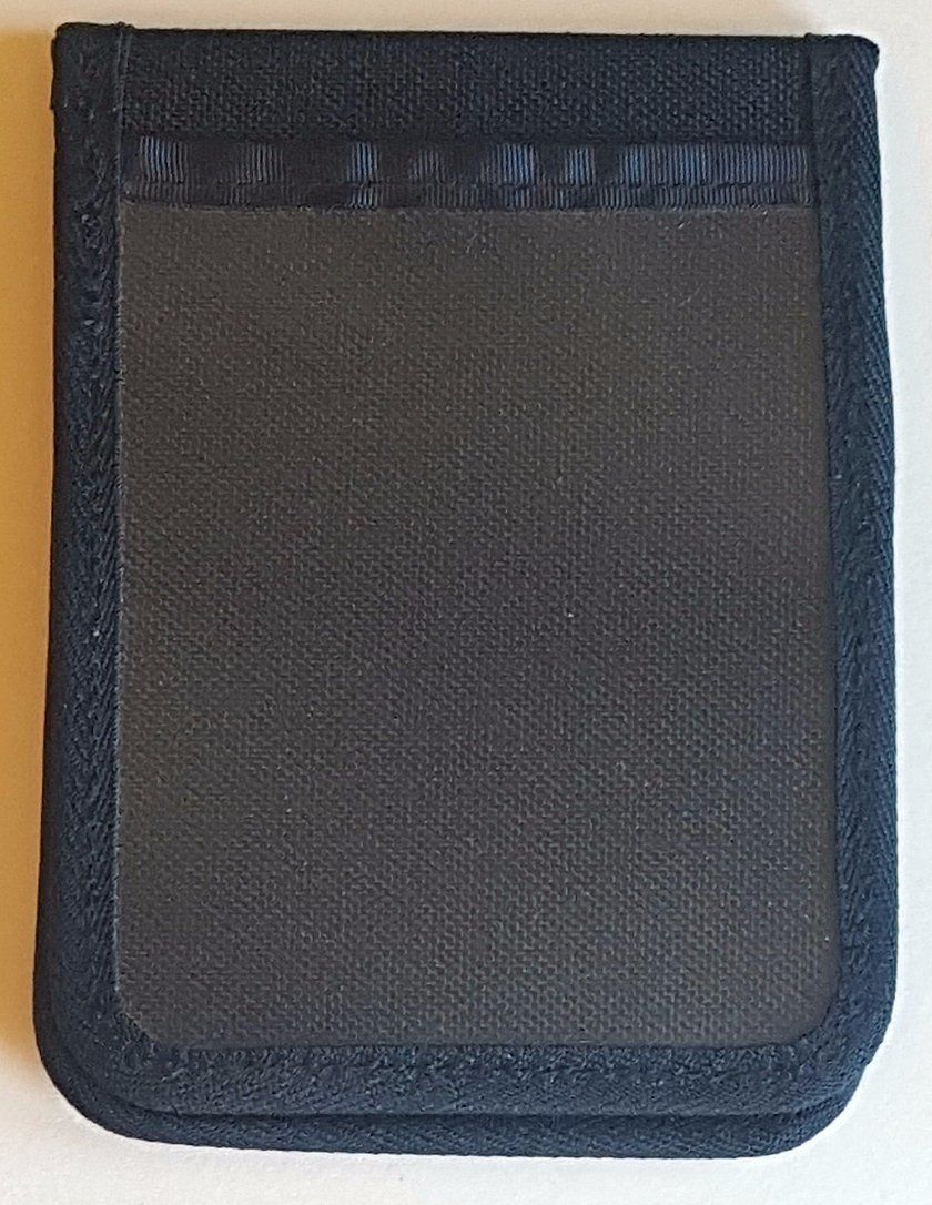 A black wallet is sitting on a white table.