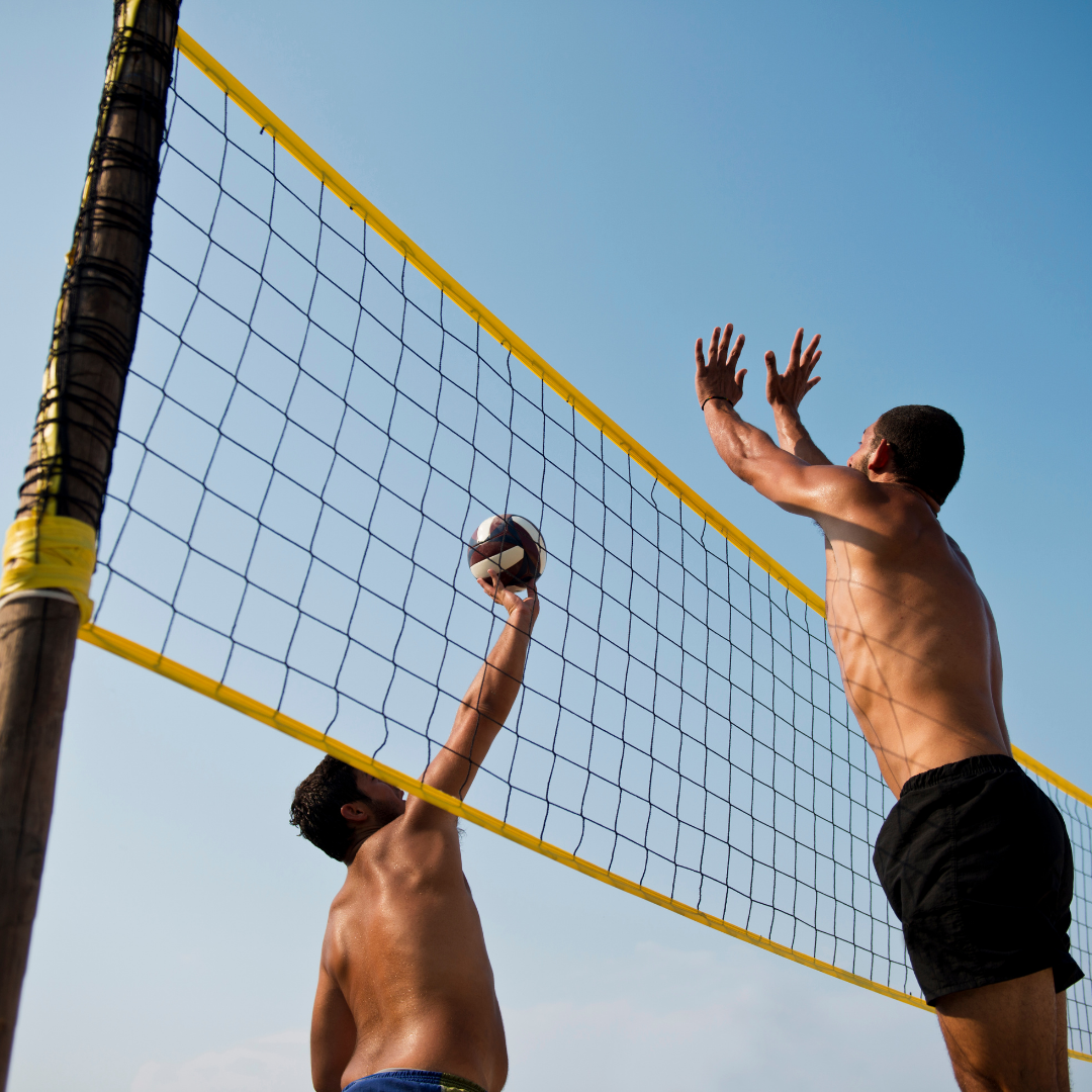 playing volleyball at corporate retreat at whisperiing springs