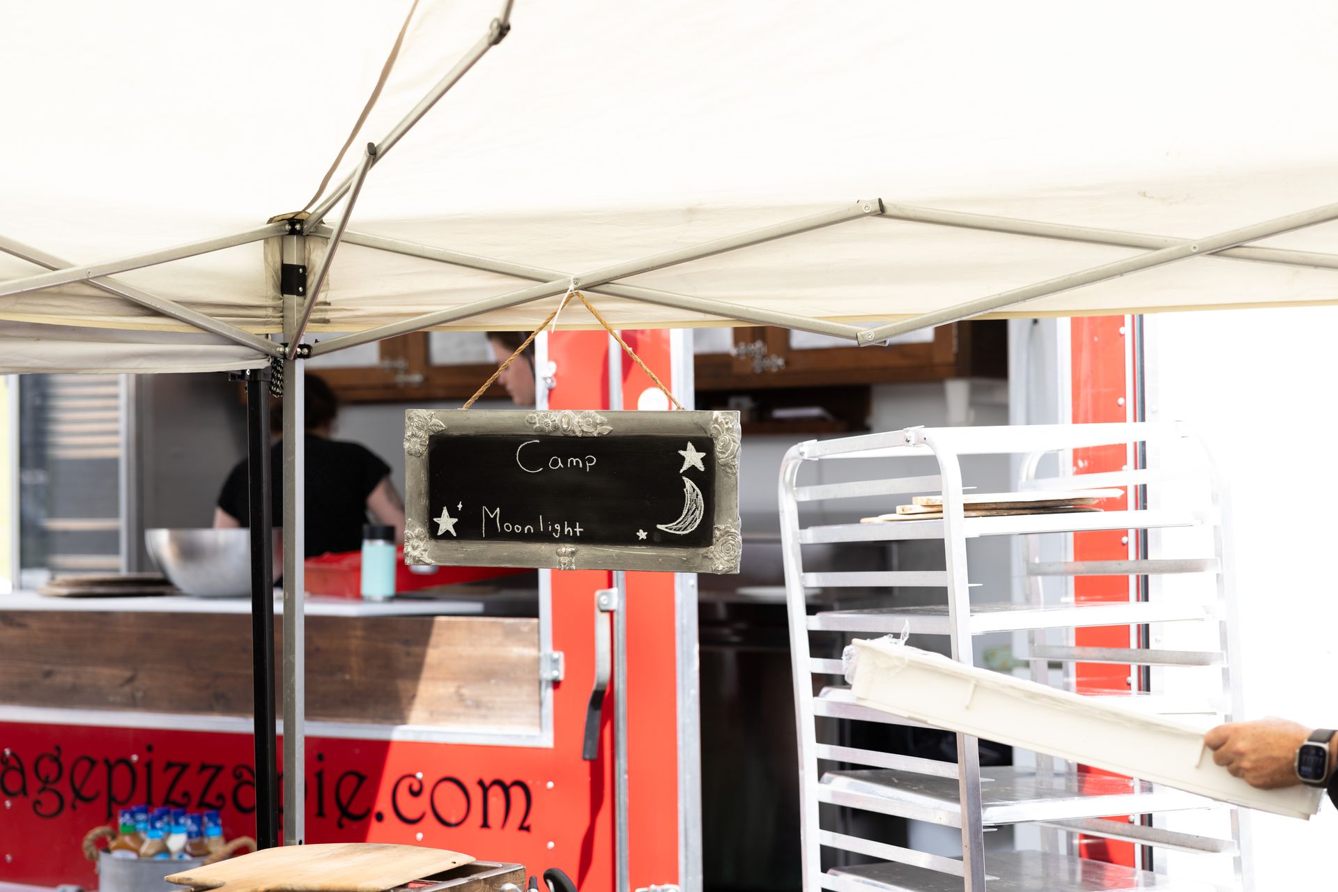 Food stand with sign for