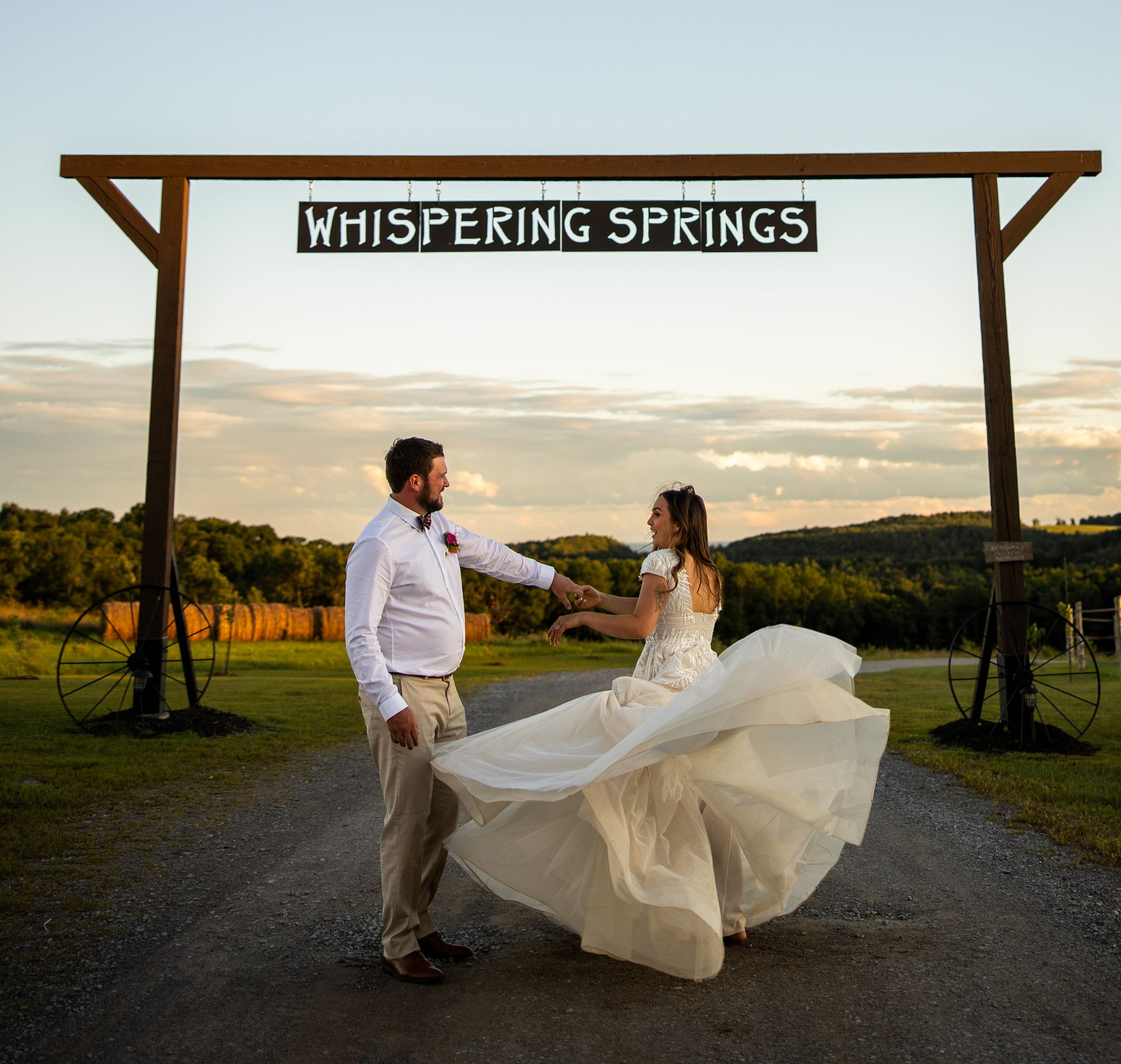 A wedding couple underneath the iconic whispering springs sing