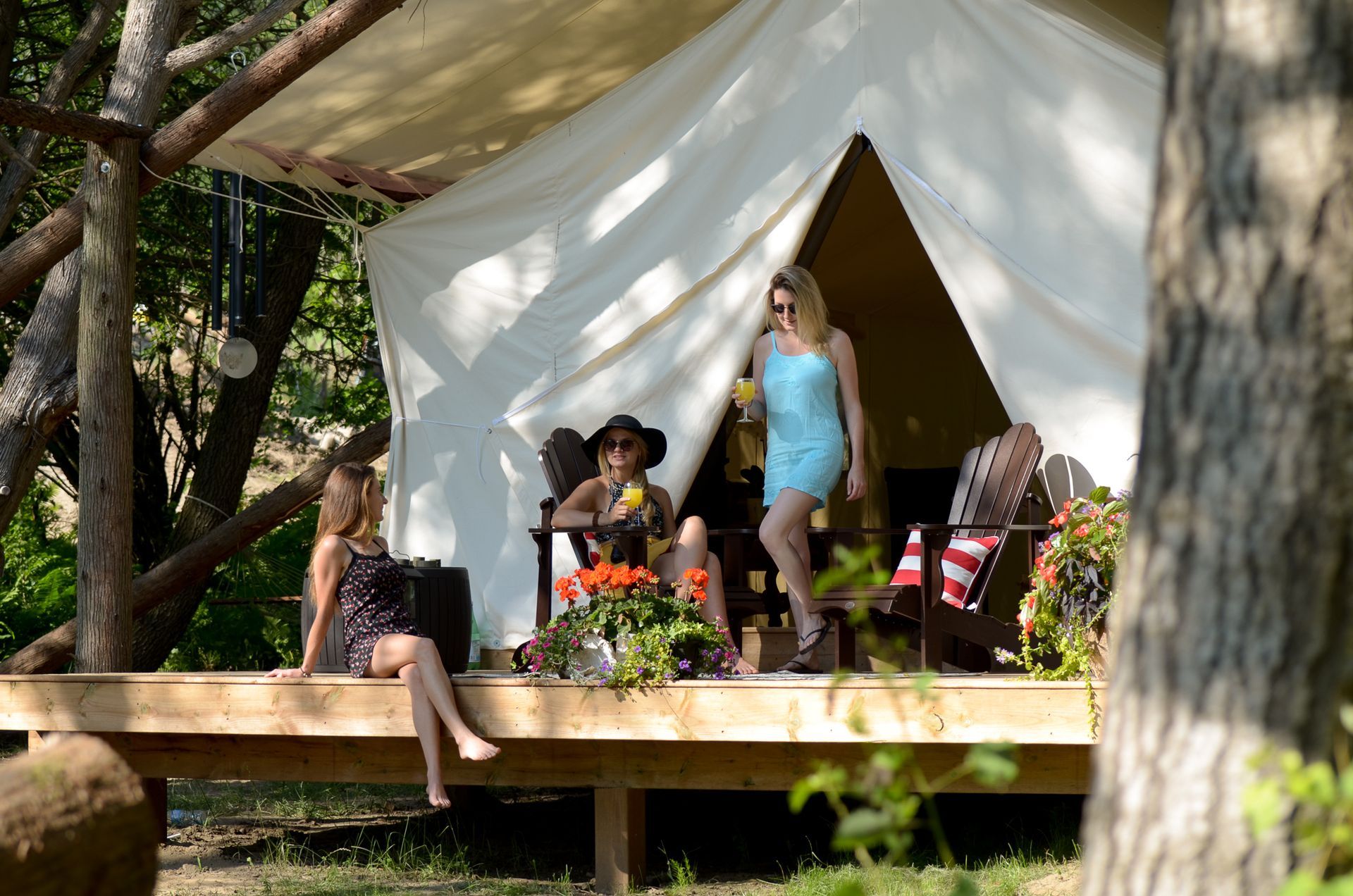 People hanging out at their luxury glamping tent at Whispering SPrings