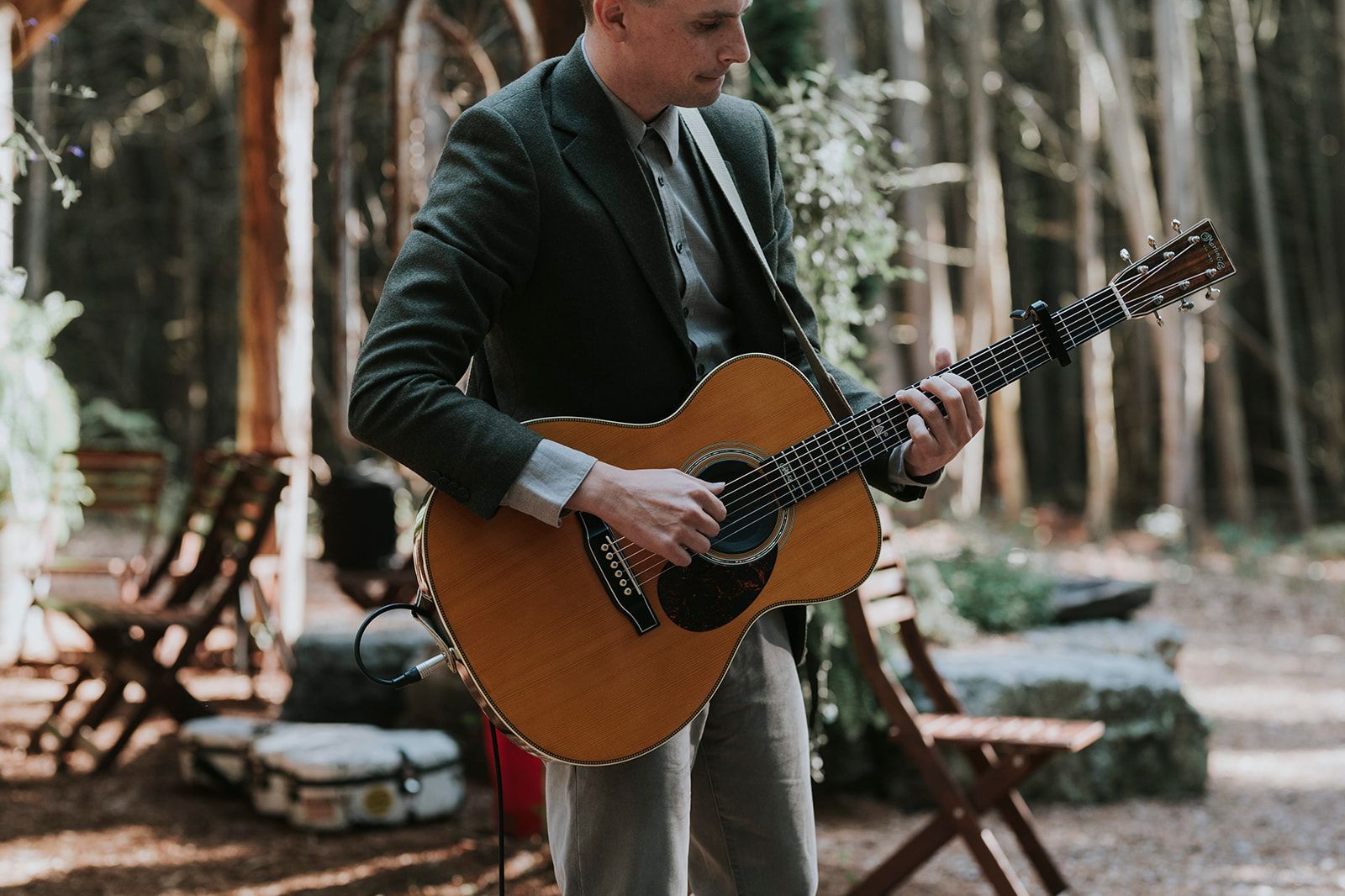 Live guitar in forest wedding ceremony at Whispering Springs