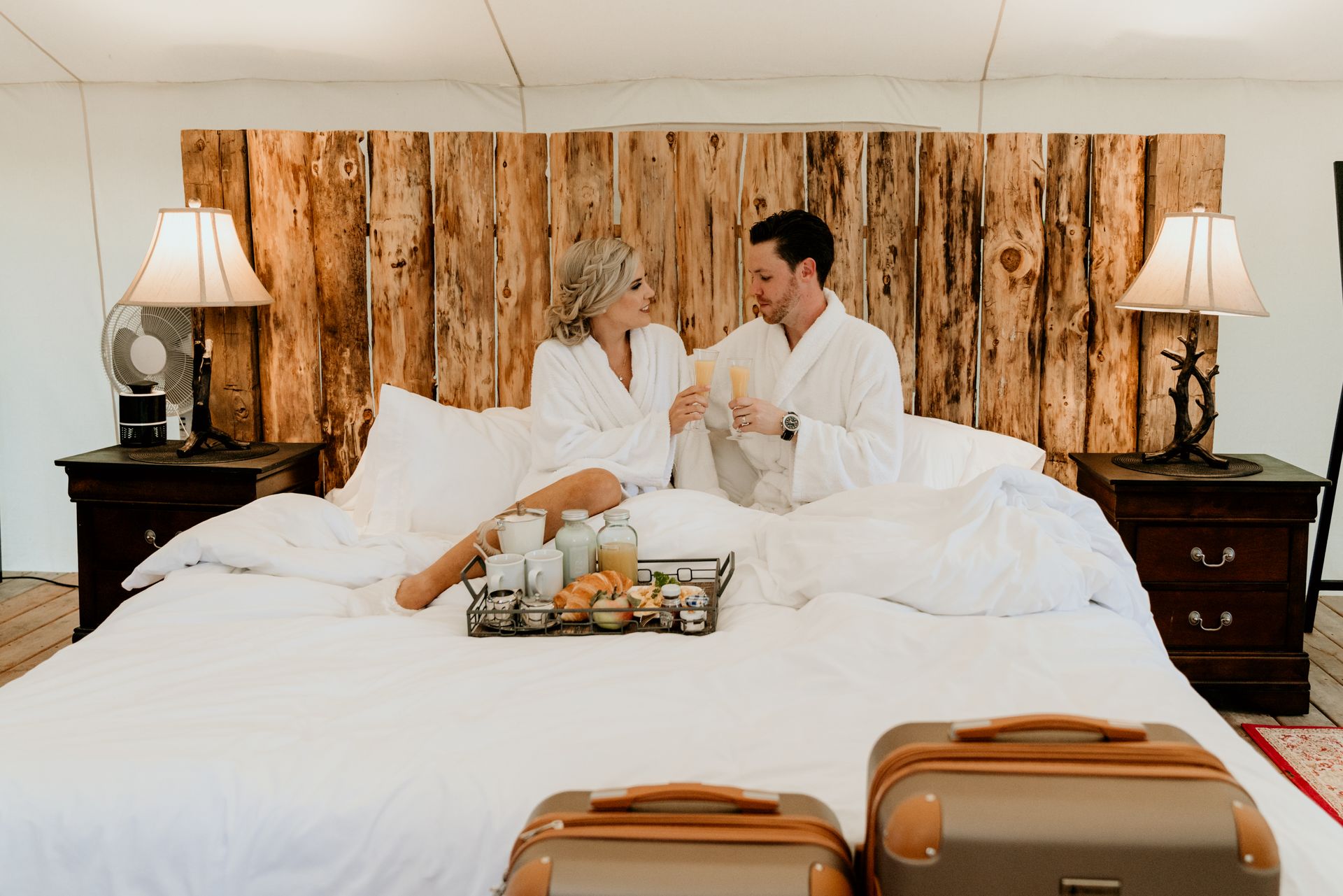Couple enjoying a luxury glamping tent at Whispering Springs Wilderness Retreat