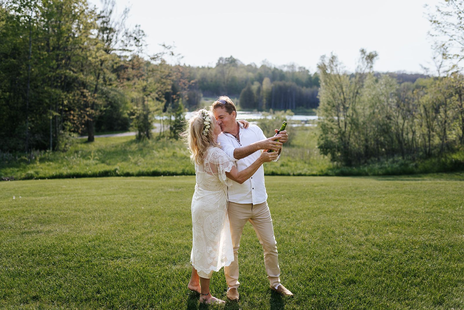 Elopement couple sprays champagane at wedding