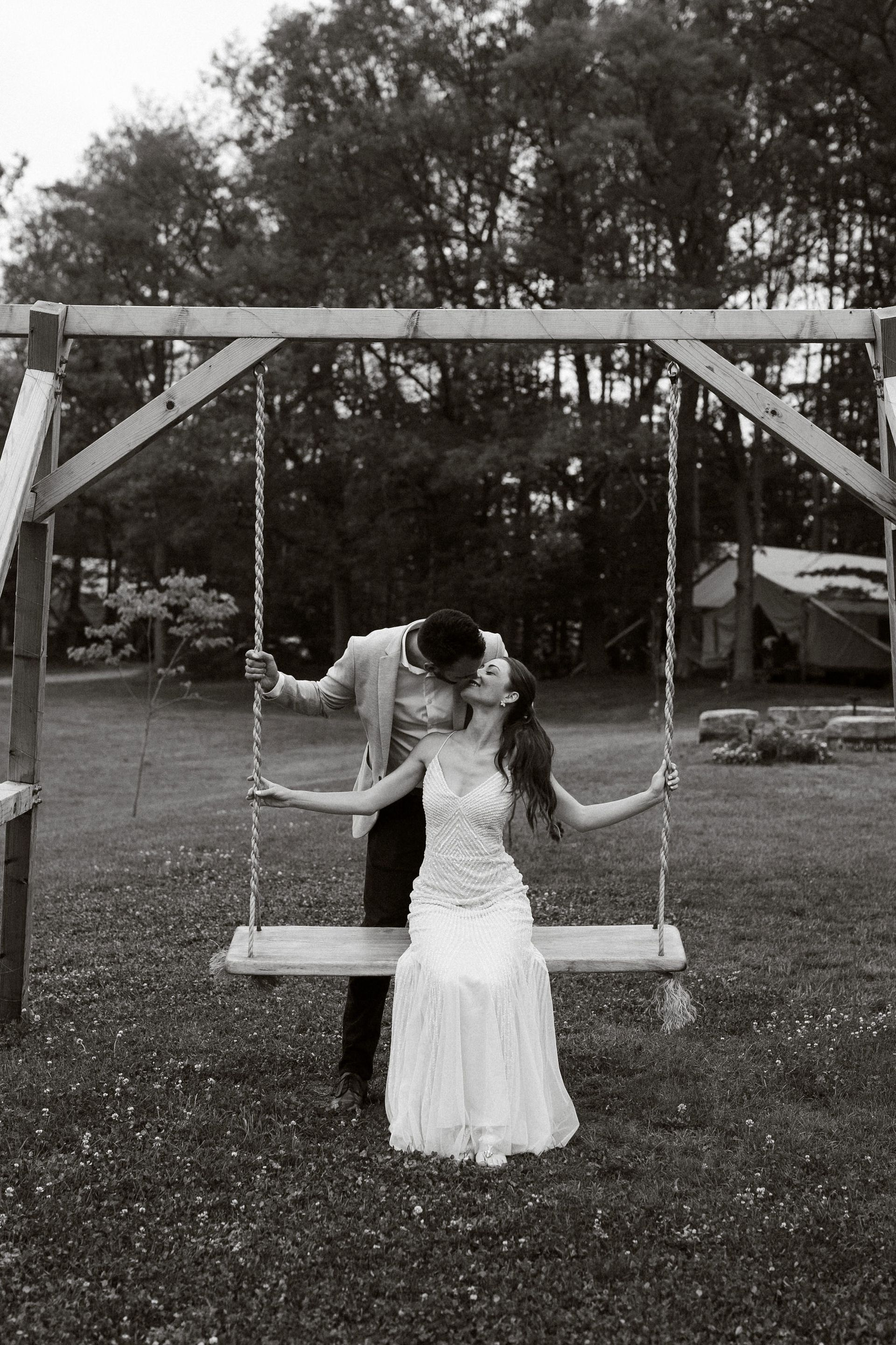 rustic swing wedding photo at whispering springs