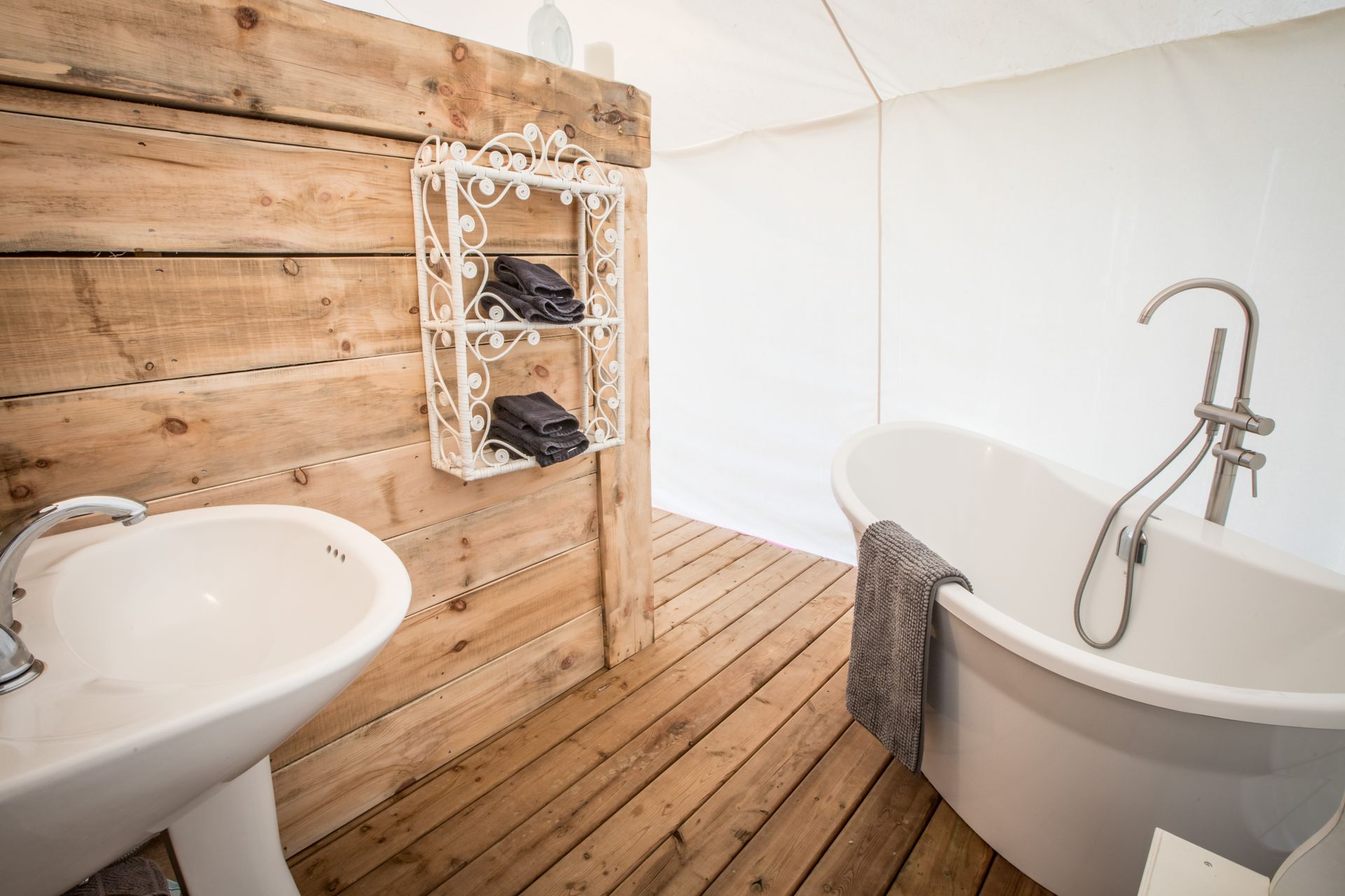 Luxurious soaker tub inside a glamping tent
