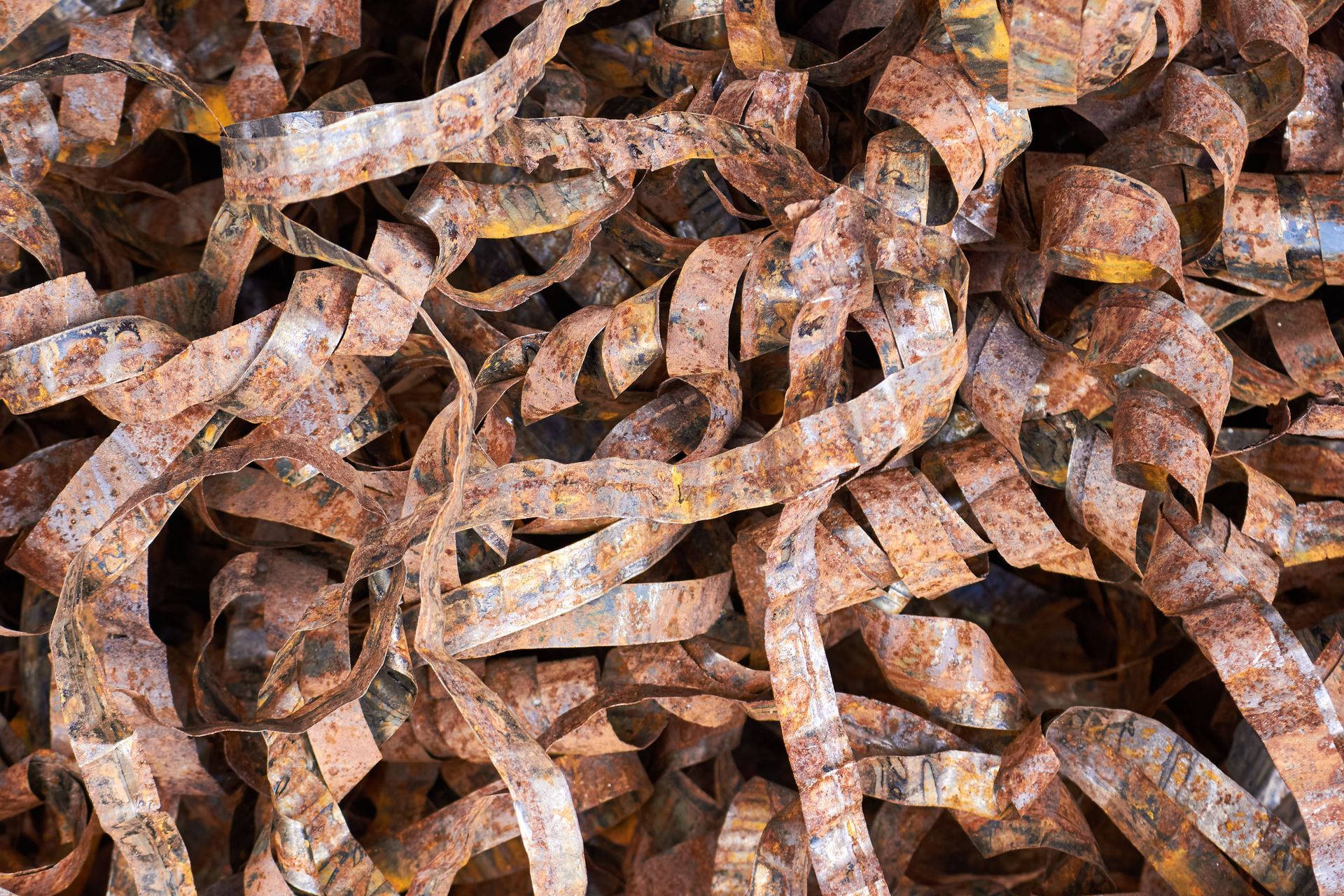 Pile of rusty metal scraps used metal braid of high voltage cable texture.