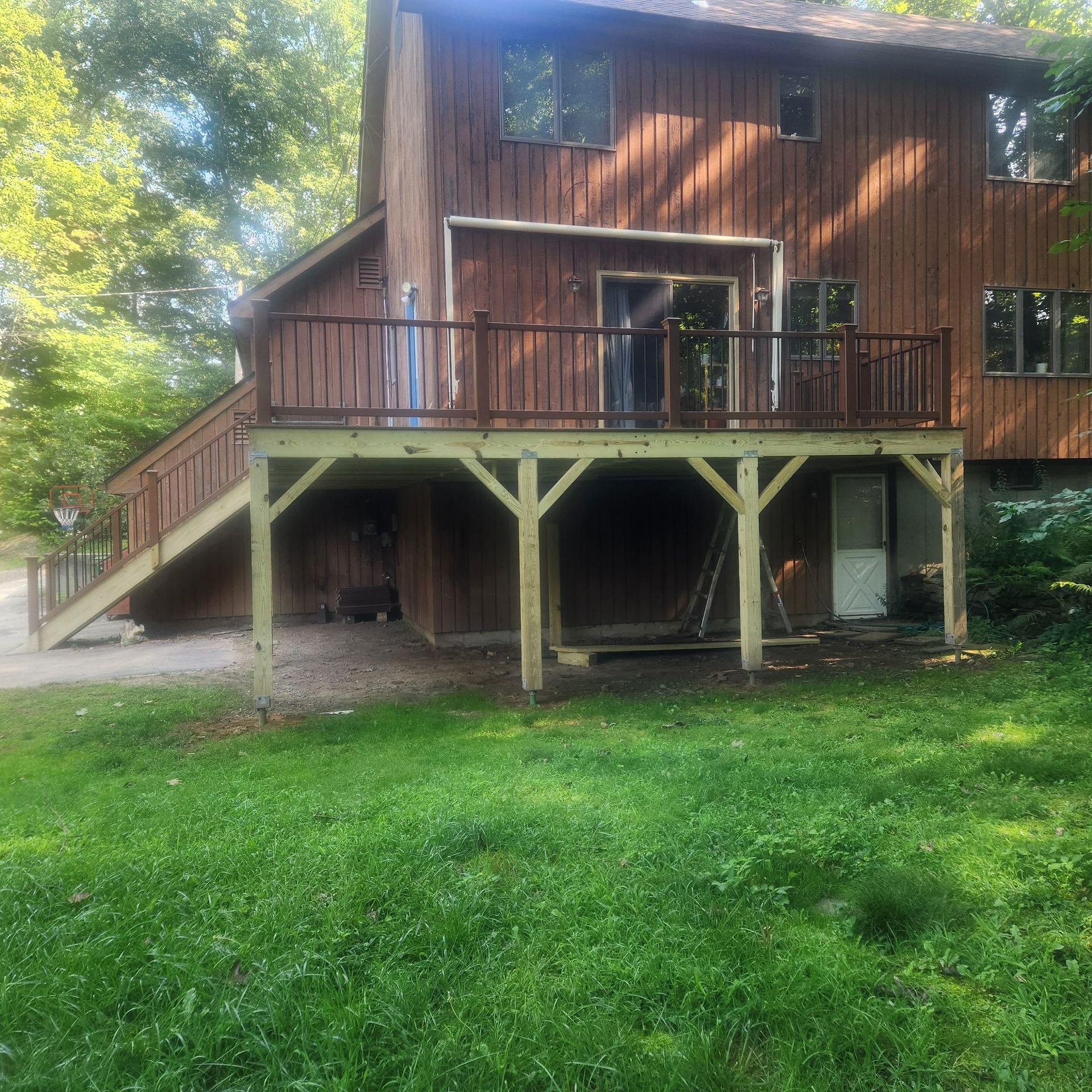 A finished deck construction and installation​ in Glastonbury CT by Exteriors of CT