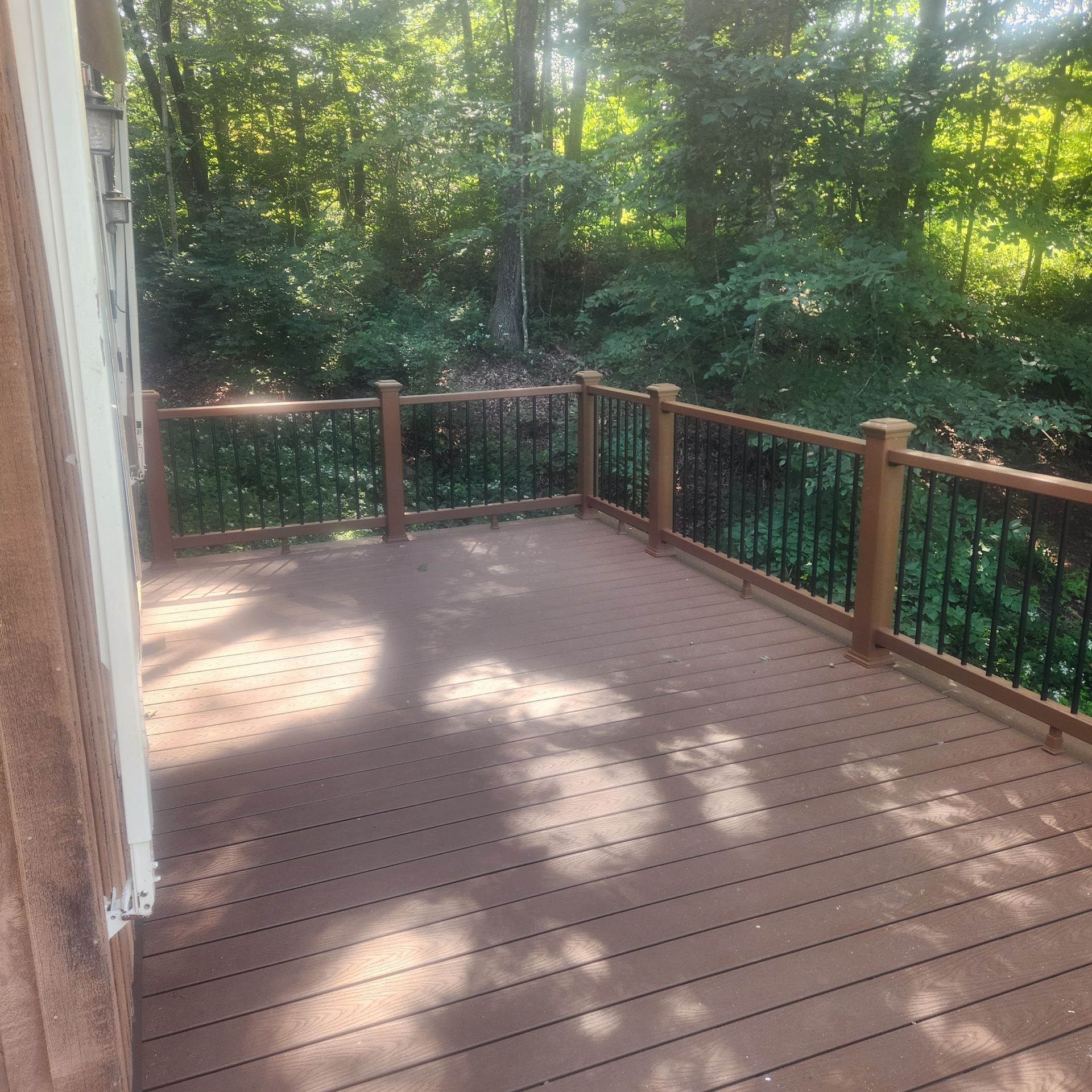 A finished deck construction and installation​ in Glastonbury CT by Exteriors of CT