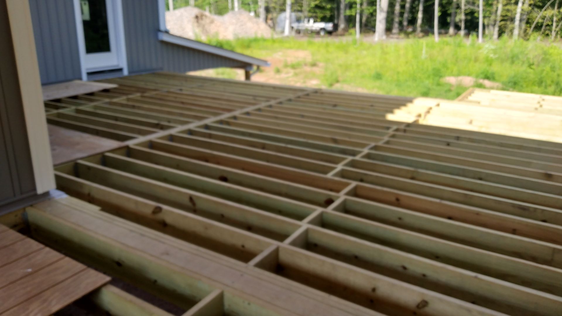 A wooden deck installation​ in Glastonbury CT in progress - Exteriors of CT hard at work