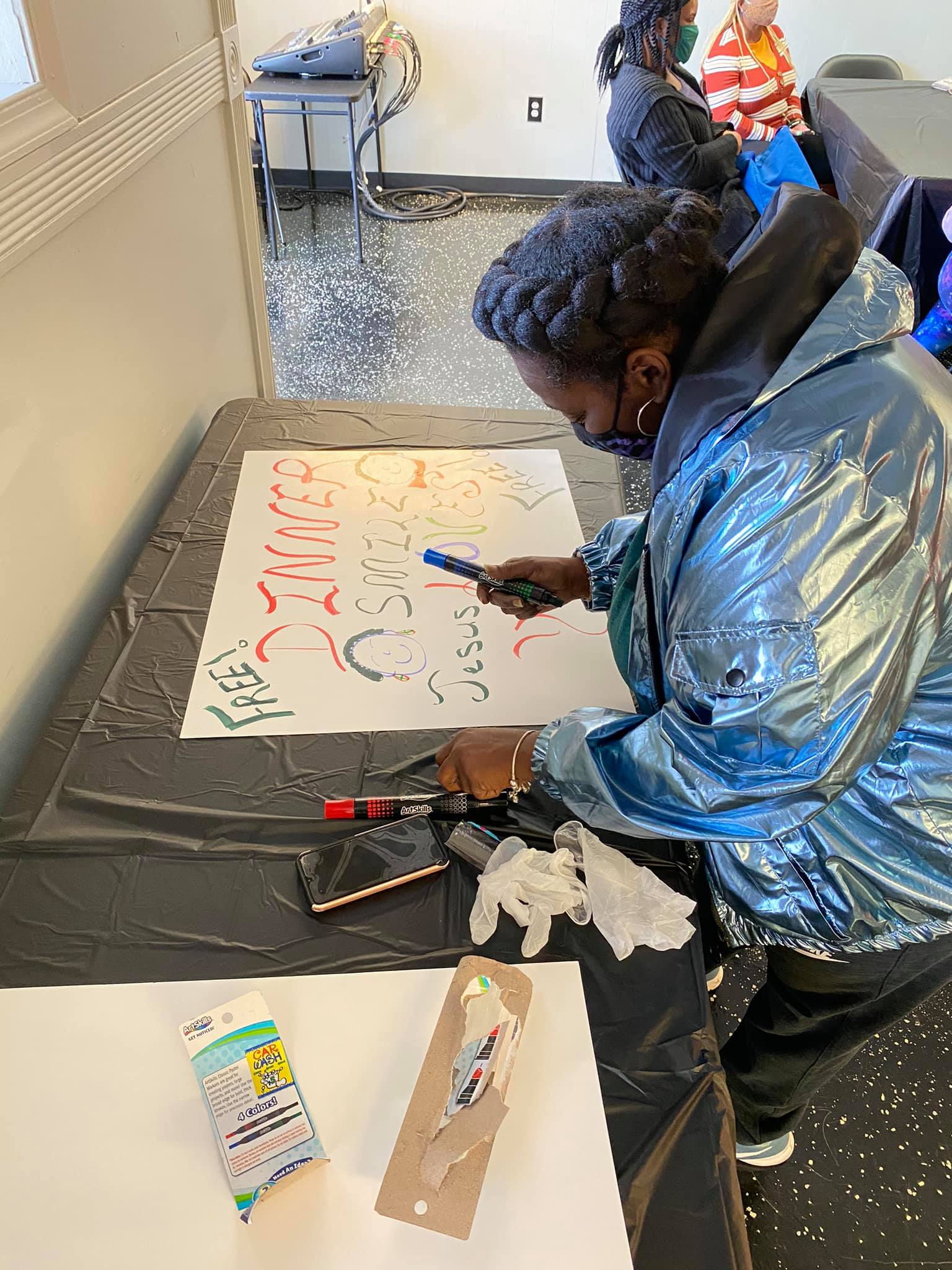 person drawing a sign