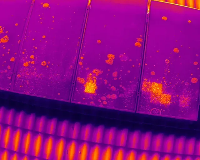 Thermal image of solar panels with hail damage