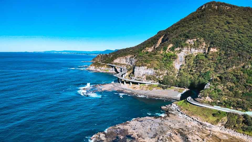 Aerial photo Seacliff Bridge, coastline, waves and rocks Coalcliff NSW 
