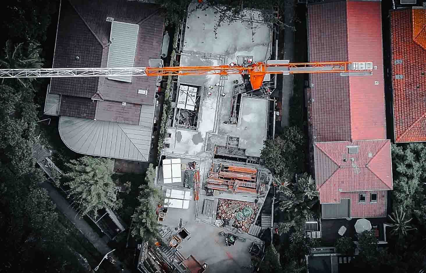 Compliant Aerial Construction Monitoring Overhead aerial photo of crane on construction site