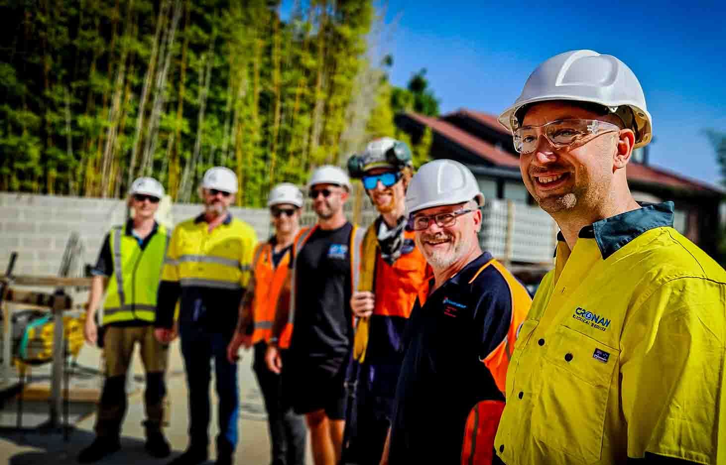 Smiling tradesman in PPE white hard hat
