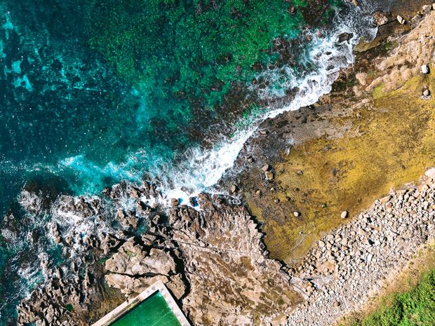 Aerial photo of rockpool, coastlines, waves and rocks Coalcliff NSW 