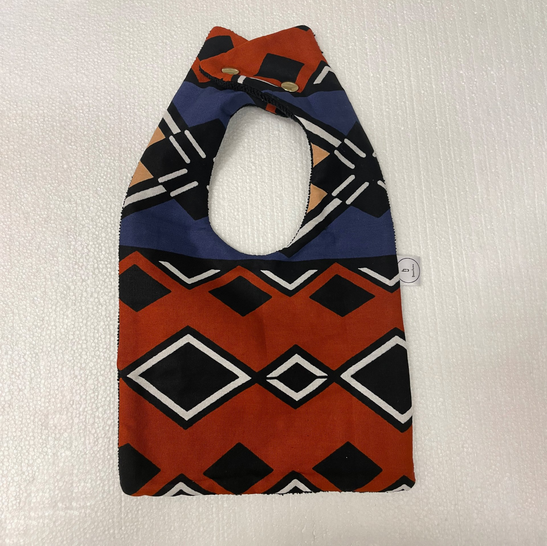 baby's bib with african print on it
