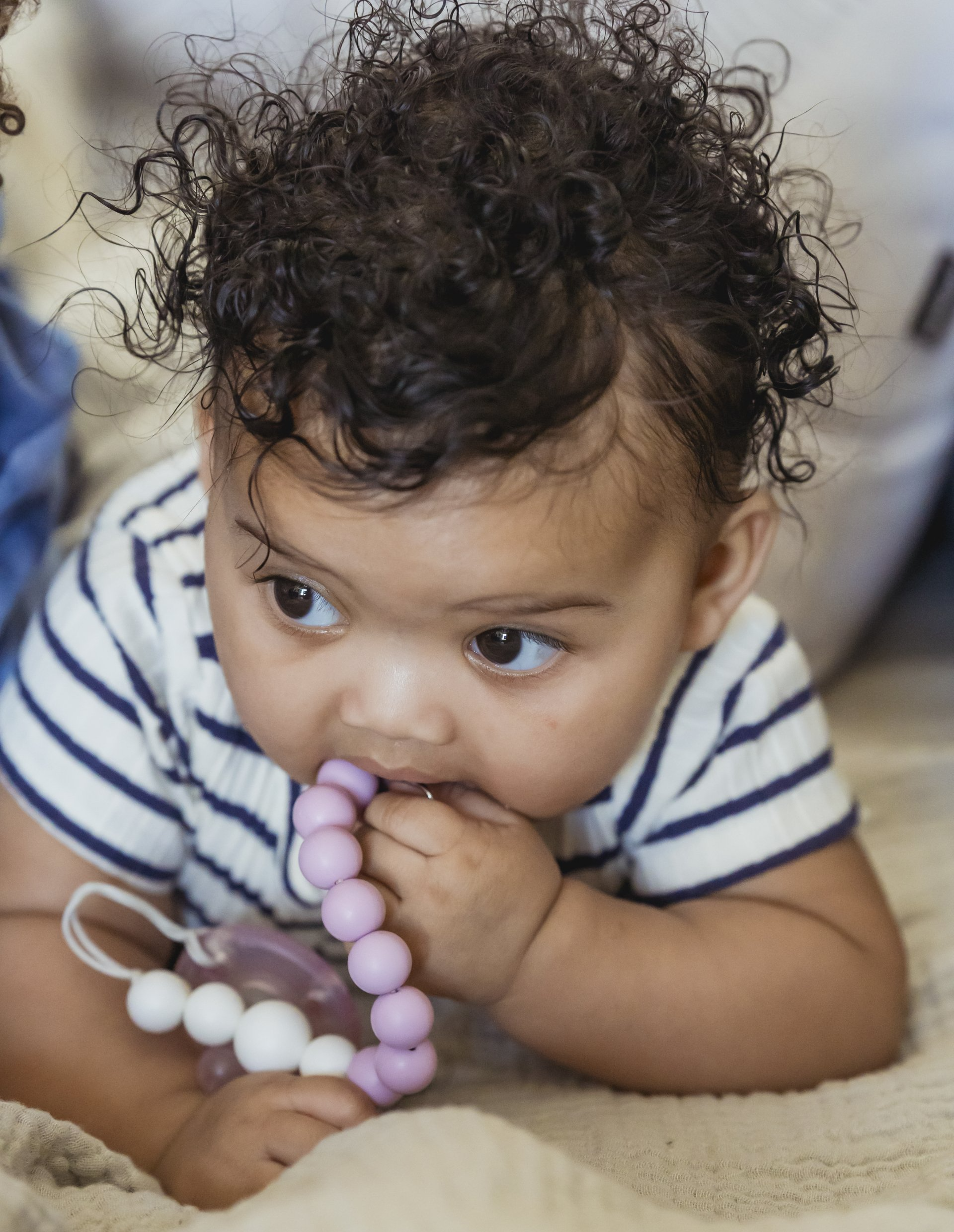 Baby teething on beads