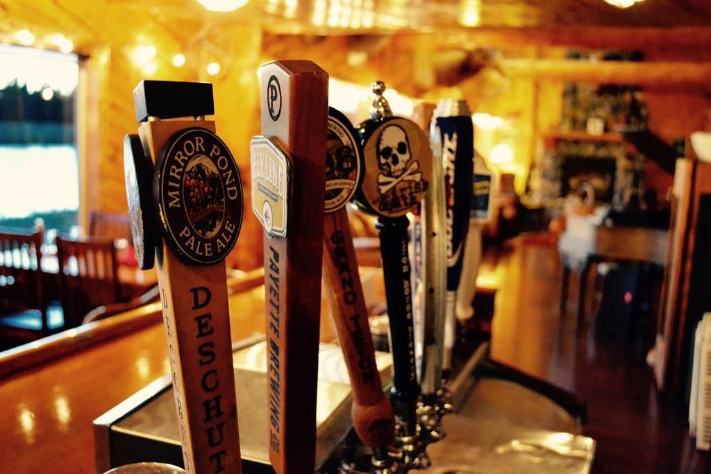 A bar with a lot of beer taps on it