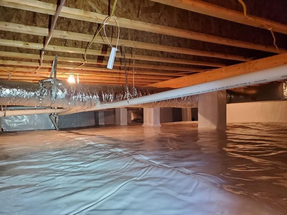 Flooded basement with standing water, exposed wooden ceiling joists, and a slanted support beam.