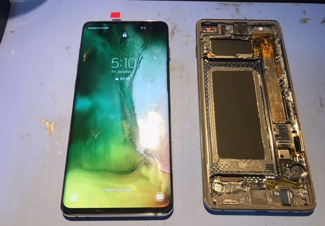 A phone with the screen removed shows the time