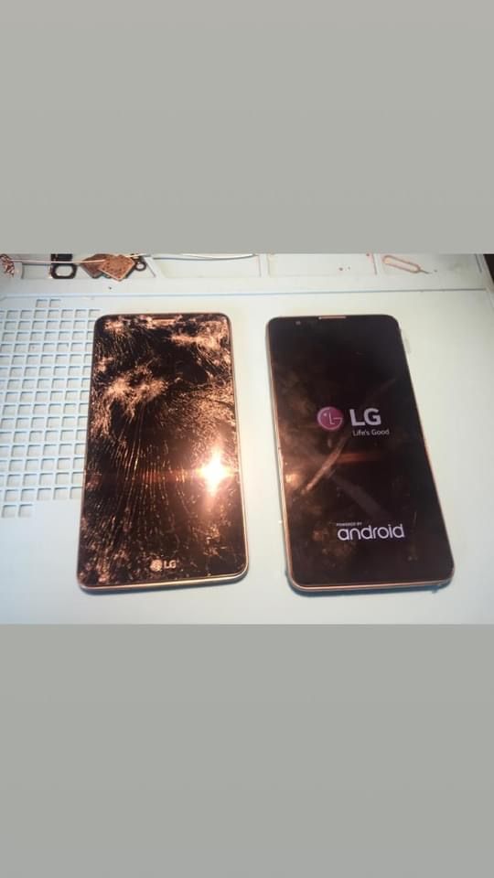 Two LG phones are sitting next to each other on a table.