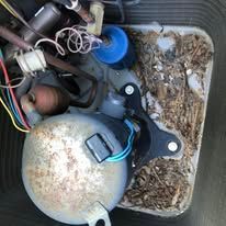 A close up of a compressor in a box.