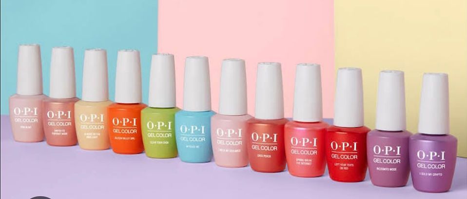 Row of OPI nail polish bottles in various pastel colors against a color-blocked background.