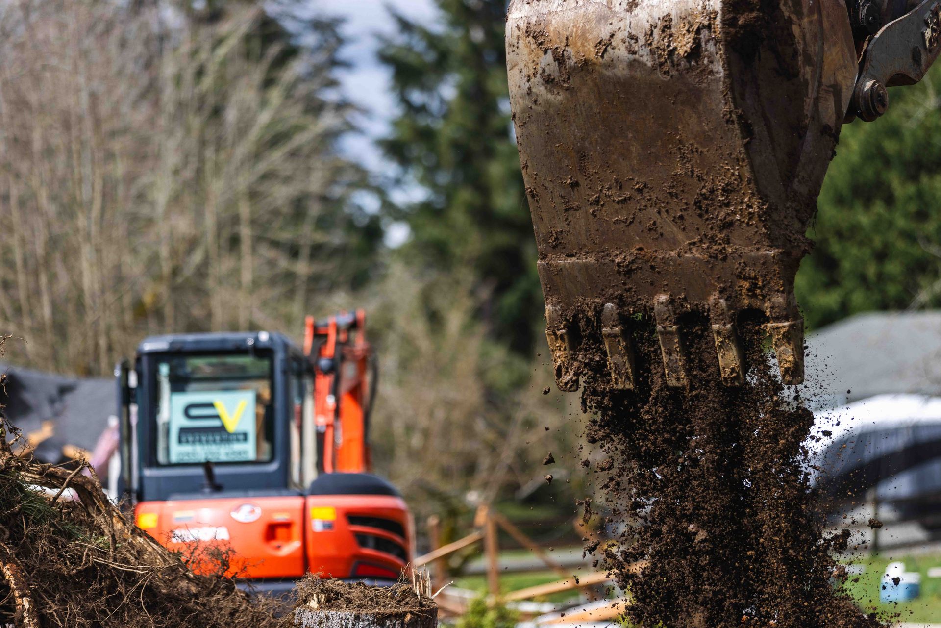 A large excavator is digging a hole in the ground.