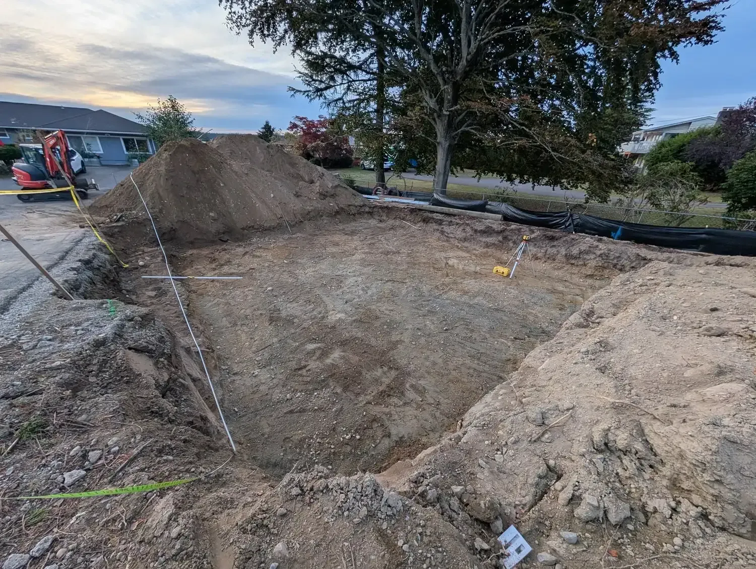 A large pile of dirt is sitting in the middle of a dirt field.