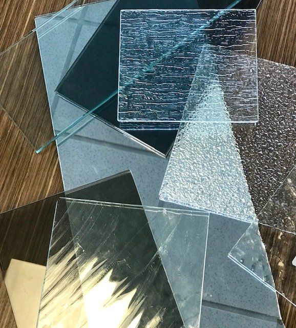 A bunch of different types of glass on a table