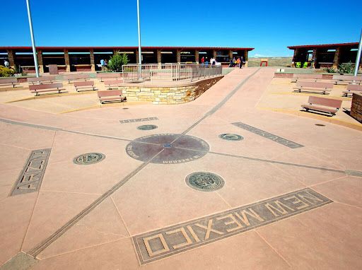 The Four Corners Monument, showing the intersection point of Arizona, New Mexico, Utah, and Colorado on a concrete plaza.
