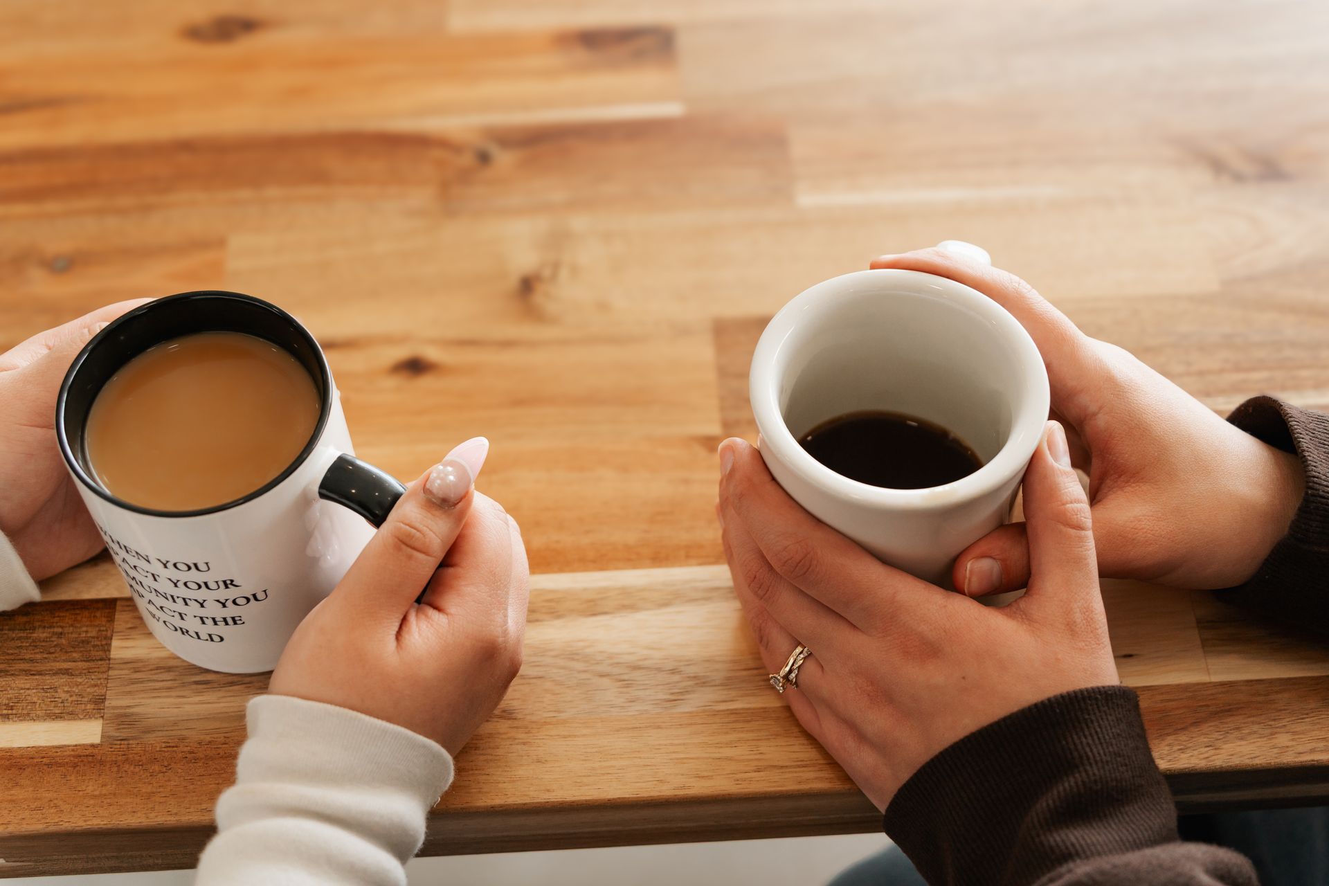 At home coffee brewing methods what does your coffee method say about you, two friends share a cup of coffee black and cream