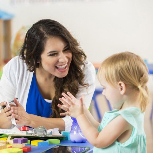 Child and Her Teacher — Kankakee, IL — Lasting Impressions Learning Centers