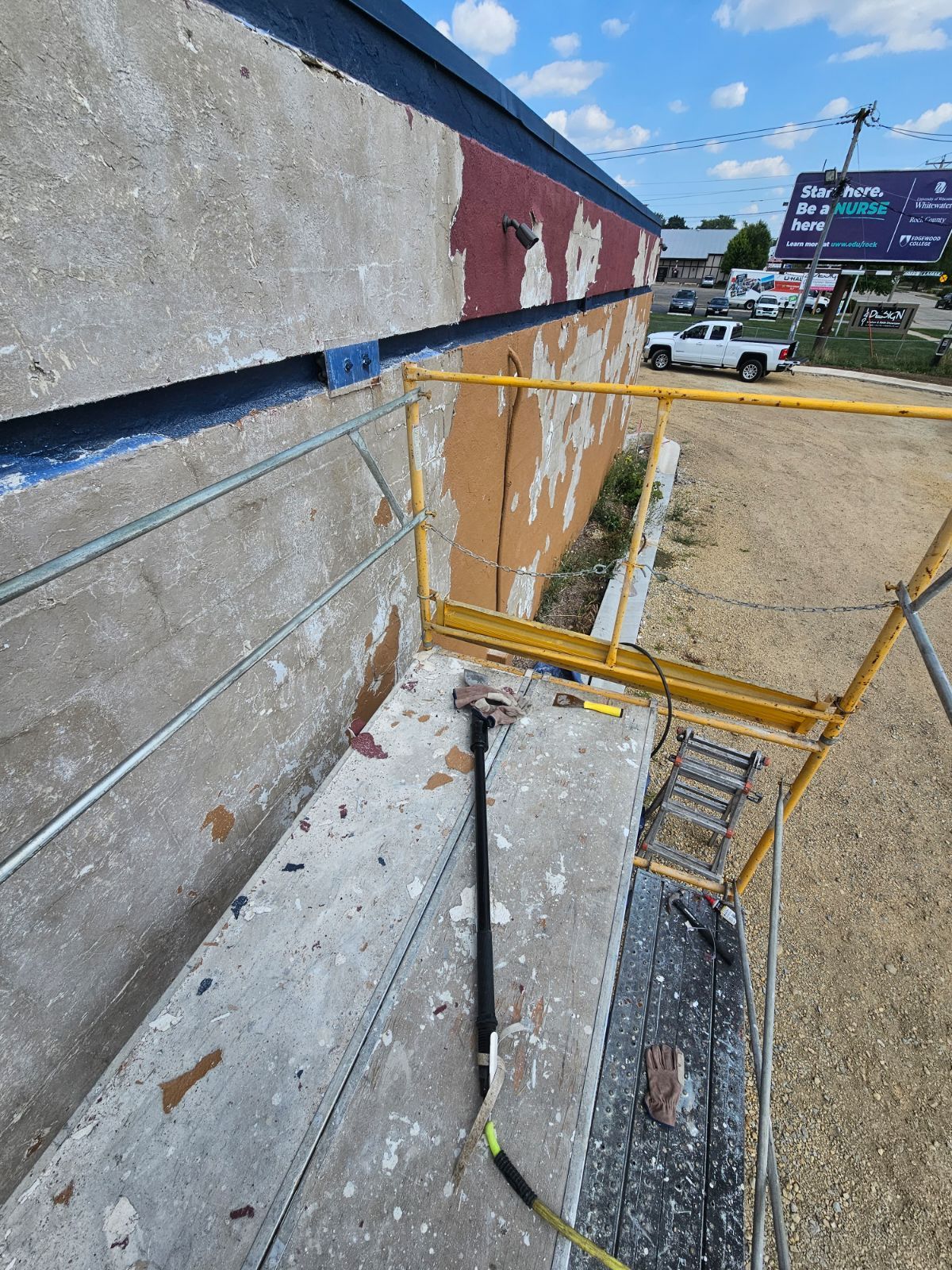 a scaffolding is sitting on the side of a building .