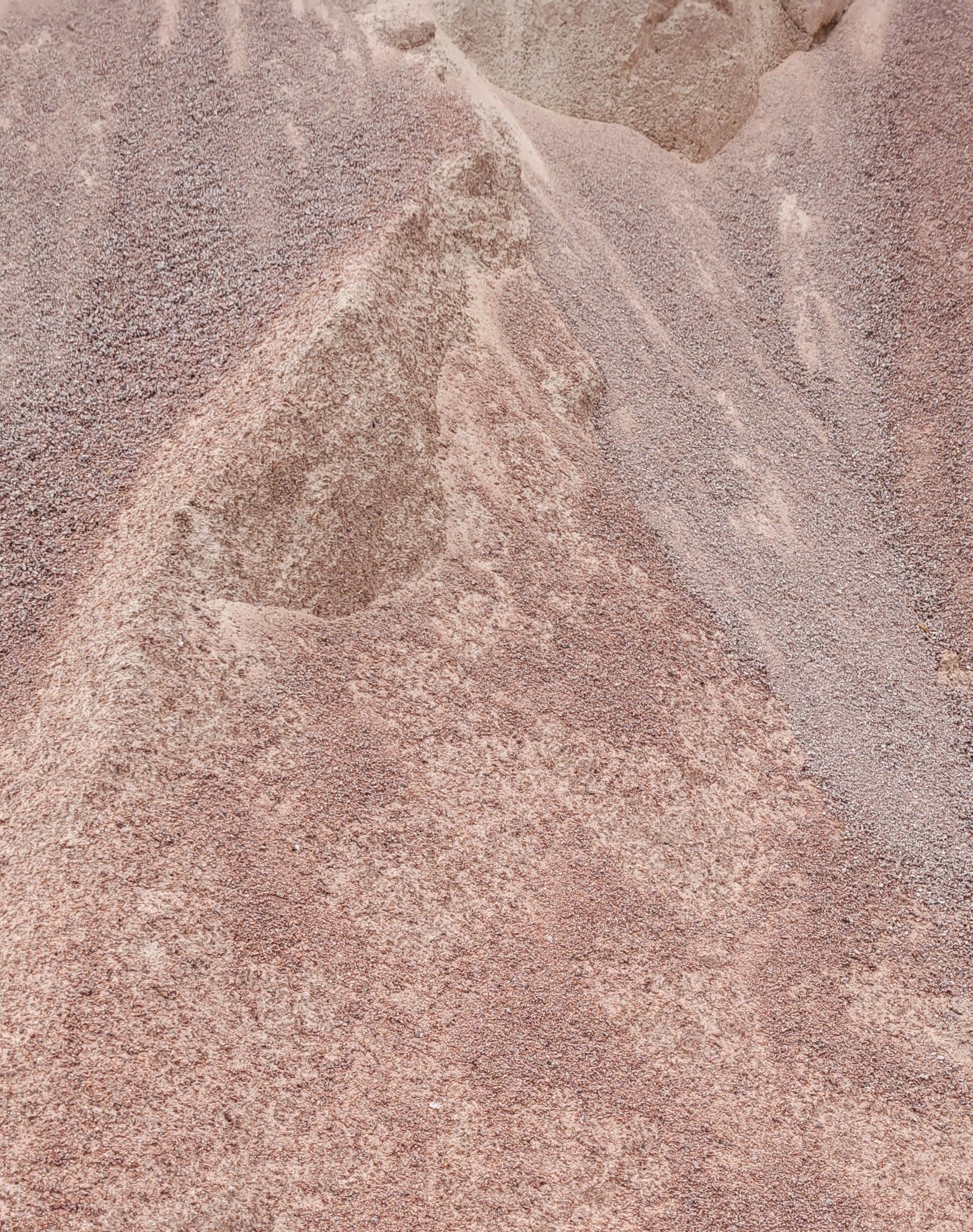 A pile of gravel is sitting on top of a white plate.