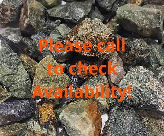A pile of rocks on a white plate on a table.
